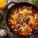 Traditional Shakshuka Eggs Poached In Spiced Tomato Sauce