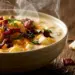 Filling Baked Potato Soup - Thefoodiebunch Creamy Baked Potato Soup Topped With Melted Cheddar, Crispy Bacon Crumbles, And Fresh Chives In A Stoneware Bowl