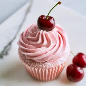 White Claw Black Cherry Cupcakes Delight - Thefoodiebunch Pink-Swirled Buttercream Cupcakes Topped With Fresh Black Cherries On A White Marble Board